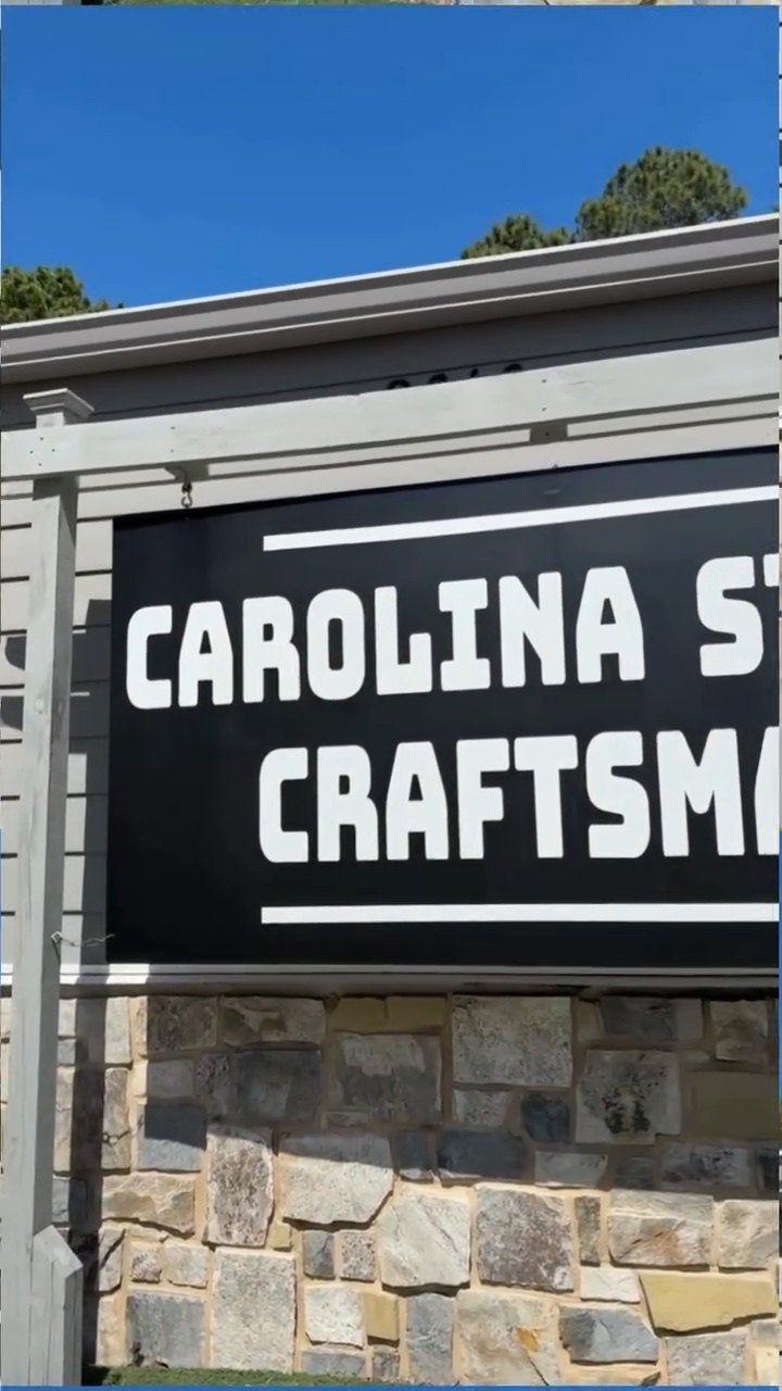 The Carolina Stone Craftsman showroom in Chapin, company sign on the stone-faced building